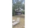 Inviting home with backyard, mature trees, and comfortable seating at 1717 Se 190Th Ave, Silver Springs, FL 34488