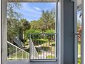 Scenic view from the balcony overlooking lush greenery and walking paths at 2533 Grassy Point Dr # 215, Lake Mary, FL 32746