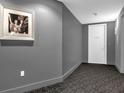 Hallway view leading to unit 1406, with a black and white photo adding a touch of classic decor at 260 S Osceola Ave # 1406, Orlando, FL 32801