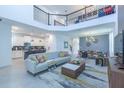 Expansive open-concept living area showcases modern decor and seamless flow to the kitchen and dining at 2924 Protagonist St, Kissimmee, FL 34746