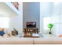 Bright living area offers tall ceilings, modern furnishings, and an inviting atmosphere at 2924 Protagonist St, Kissimmee, FL 34746