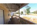 View from the covered porch of a single-story home, looking out to the street at 39 S College Ave, Maitland, FL 32751