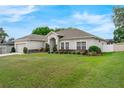 Beautiful single-story home featuring a well-maintained lawn and an attached two-car garage at 3956 Shadowind Way, Gotha, FL 34734