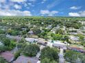 Aerial view of a residential area with tree-lined streets and well-maintained houses at 517 Ivanhoe Way, Casselberry, FL 32707