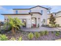 Attractive home boasting a stone entrance, brick walkway, landscaping and a two-car garage at 5550 Sabal Dr, St Cloud, FL 34771