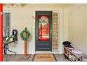 Eye-level shot of front door, decorated with a wreath and a welcome mat for an inviting entrance at 618 Acapulca Way, Altamonte Springs, FL 32714