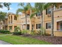 Charming two-story home with a well-manicured lawn and lush tropical landscaping at 8430 Leatherleaf Ln, Orlando, FL 32827