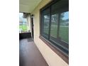 Inviting front porch featuring screened entry door and fresh paint at 1335 Cr 442, Lake Panasoffkee, FL 33538
