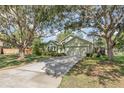 Lovely single-story home featuring an attached two-car garage and well-manicured landscaping at 16103 Denham Ct, Clermont, FL 34711