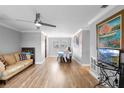 Bright living room featuring hardwood floors, a ceiling fan, and neutral wall colors at 1647 Crestlawn Ave, Orlando, FL 32811