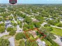 An aerial view shows the location of the home in a tree-filled neighborhood near Winter Park at 1901 Loch Berry Rd, Winter Park, FL 32792