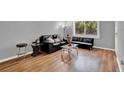 Cozy living room with hardwood floors, comfortable seating, and lots of light at 1940 S Conway Rd # 8, Orlando, FL 32812