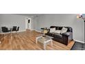 Inviting living room with hardwood floors, modern furniture, and a dining area at 1940 S Conway Rd # 8, Orlando, FL 32812