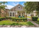 Inviting exterior with symmetrical windows, a covered porch, and neat landscaping, creating a cozy curb appeal at 2246 Florida Soapberry Blvd, Orlando, FL 32828