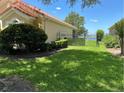 Backyard and fence overlooking water view beyond fence at 2258 Rickover Pl, Winter Garden, FL 34787