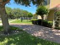 Paved driveway leading to a two-story home with well maintained landscaping at 2258 Rickover Pl, Winter Garden, FL 34787