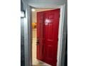 Charming entryway featuring a red door and ceramic tile flooring at 2847 W Harwood St # 0, Orlando, FL 32805