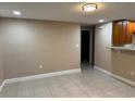 Bright, tiled living room with access to the kitchen area at 2847 W Harwood St # 0, Orlando, FL 32805