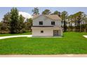 Charming two-story home with a well-manicured lawn provides a picture-perfect setting at 300 Mitnik Dr, Deltona, FL 32738