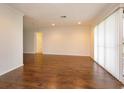 Spacious living room featuring wood floors, natural light, and neutral paint at 4739 Indian Gap Dr, Orlando, FL 32812