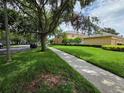 Exterior street view displaying well-maintained sidewalks and lush landscaping at 14474 Prunningwood Pl, Winter Garden, FL 34787