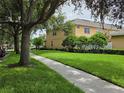 Exterior street view displaying well-maintained sidewalks and lush landscaping at 14474 Prunningwood Pl, Winter Garden, FL 34787