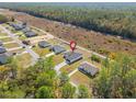Aerial view shows home nestled in a neighborhood close to forest, indicated with a pin drop at 16730 Sw 50Th Cir, Ocala, FL 34473