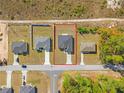 Aerial view of the home with property lines outlined in red, in a neighborhood close to forest at 16730 Sw 50Th Cir, Ocala, FL 34473