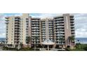 Multi-story beachfront condo building boasts ocean views from private balconies and lush landscaping in a serene setting at 1925 S Atlantic Ave # 411, Daytona Beach, FL 32118