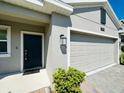 Close up of the front door and garage door of this beautiful home at 2807 Alder Berry Blvd, Ocoee, FL 34761