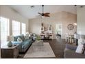 Bright and airy living room with vaulted ceilings, modern furnishings, and seamless open-concept design at 32937 Scenic Hills Dr, Mount Dora, FL 32757