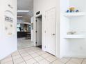 Bright hallway featuring tiled floors, art niches and an open view to the living area at 512 Viola Dr, Davenport, FL 33837
