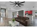Open-concept living room featuring modern finishes and access to kitchen at 545 Hardwood Cir, Orlando, FL 32828