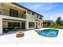 Beautiful backyard with a private pool, fire pit, and covered patio perfect for outdoor entertaining and relaxation at 8480 Adalina Pl, Orlando, FL 32827