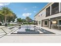 Beautiful backyard pool with water features, lounge seating, and outdoor bar at 15779 Tangerine Dream Ct, Winter Garden, FL 34787