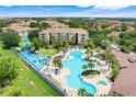 Aerial view of a stunning resort style pool, jacuzzi and fun splashpad at 2821 Almaton Loop # 105, Kissimmee, FL 34747