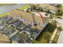 An aerial view of the property showing the screened in pool and surrounding area at 3085 Tom Sawyer Dr, Kissimmee, FL 34746