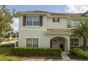 Charming two-story home featuring neat landscaping, tiled roof and covered entry way at 3085 Tom Sawyer Dr, Kissimmee, FL 34746