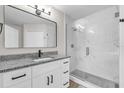 Modern bathroom featuring granite counters, glass shower, and a sleek, contemporary design at 3622 Huntwicke Blvd, Davenport, FL 33837