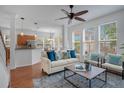Inviting living room with hardwood floors and a ceiling fan showcasing the home's open layout at 4065 Anissa Ave, Orlando, FL 32814