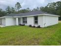 Charming single-story home featuring a two-car garage and a well-maintained lawn at 4333 Sw 157Th Ter, Ocala, FL 34481