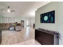Spacious living room features tile and wood flooring, comfortable seating, and modern decor at 5517 W Sacramento Ct, Orlando, FL 32821