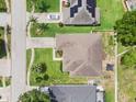 An aerial view showcases the property's roof, yard, and neighborhood at 610 Strihal Loop, Oakland, FL 34787