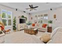 Bright and airy living room featuring neutral tones, large windows, and stylish furnishings at 888 Wakulla Ln, Winter Springs, FL 32708