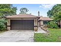 Charming single-story home with a two-car garage, well-maintained lawn, and inviting curb appeal at 942 Beach Breeze Dr, Orlando, FL 32835