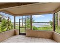 Screened patio offers stunning lake views and provides a seamless transition to the outdoors at 942 Beach Breeze Dr, Orlando, FL 32835