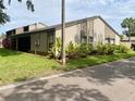 Exterior showcasing mature landscaping, screened in porch, and a view of the home's architecture at 1110 Woodbine Street, Fern Park, FL 32730