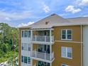 Exterior of a home featuring multiple private balconies and a neutral color palette at 1200 Ironsmith Dr # 508, Celebration, FL 34747