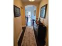 Inviting hallway with elegant decor, hardwood floors, and arched entryway to a cozy living space at 1200 Ironsmith Dr # 508, Celebration, FL 34747