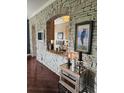 Open-concept living area with stone accents, modern lighting, and elegant decor creating a warm ambiance at 1200 Ironsmith Dr # 508, Celebration, FL 34747